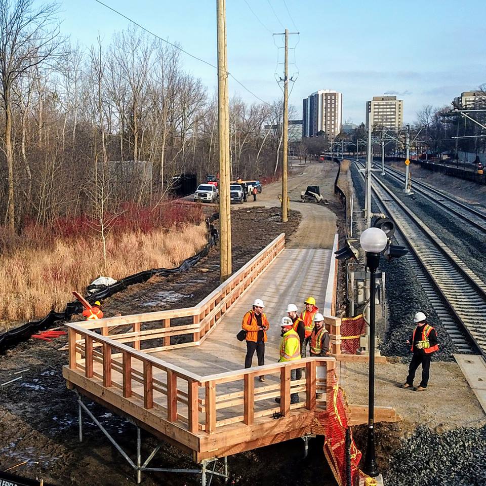 Aerial view of the Waterloo Park Promenade Boardwalk.  Timber framed ramp on helical piles.  Designed to provide access up to a train track crossing.