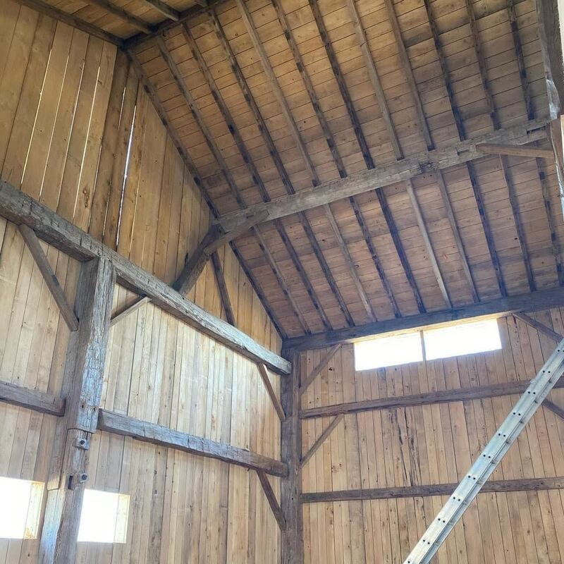 Interior of a restored timber barn.
