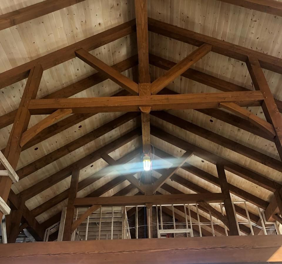 Timber framing in a houses great room.
