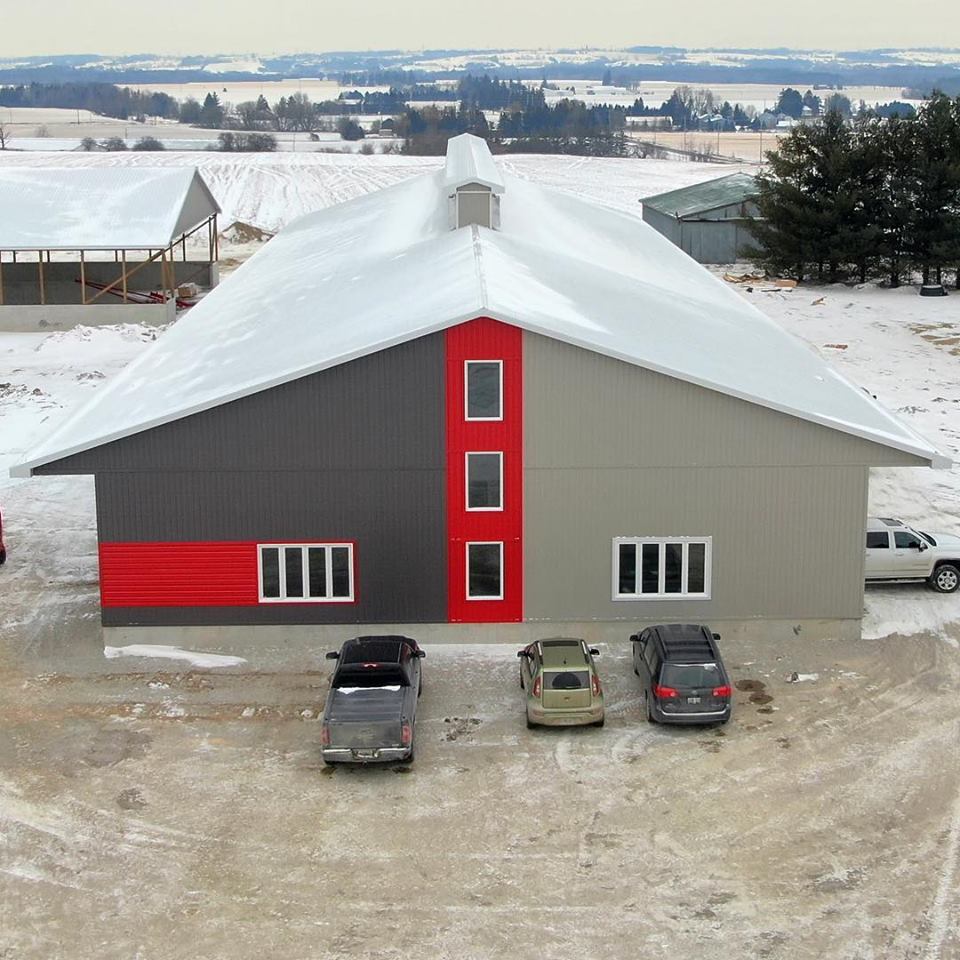 Barn with Architectural Improvements. 66x250 Robotic Dairy Barn. By Glen Valley Construction. Dairy Barn. Drone Picture