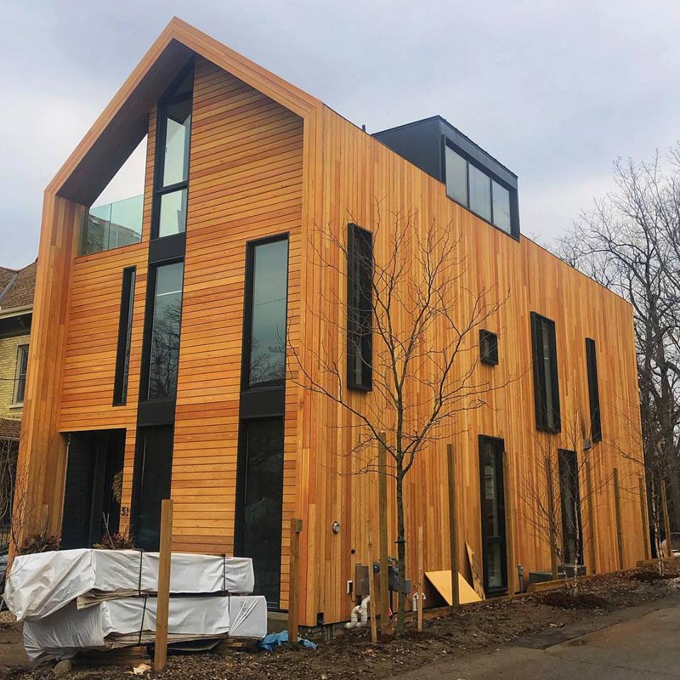 Modern house with wood siding.  Created with steel moment frames.