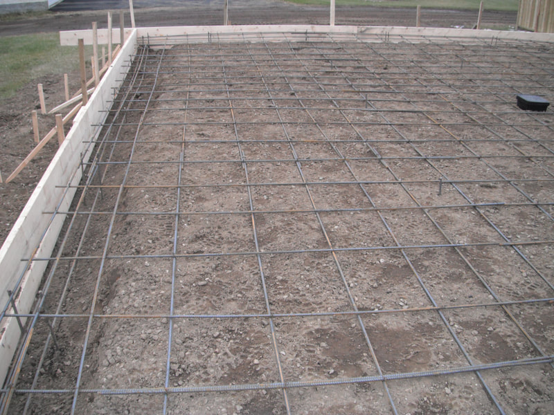 Floating slab foundation ready to be poured.  10M rebar grid for crack control is shown. 