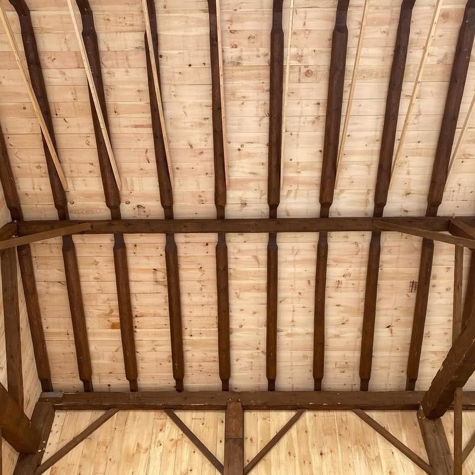 Interior view of timber frame roof.  Barn restoration project.  Timbers are reclaimed and cladding is new.  