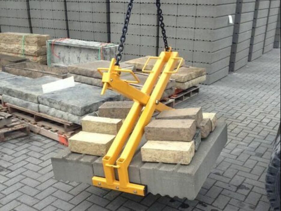 Blocks being lifted with a scissor lifting device.